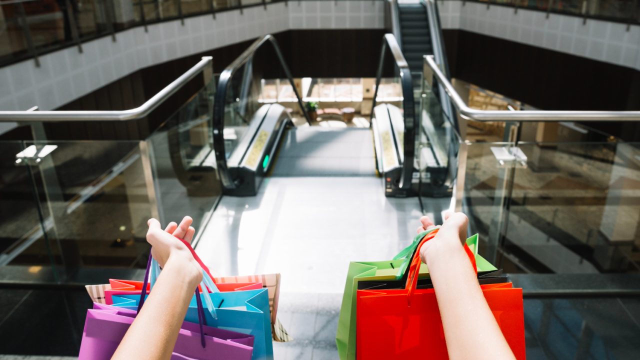 crop-hands-holding-paper-bags Outlet Malls and Lifestyle Centers